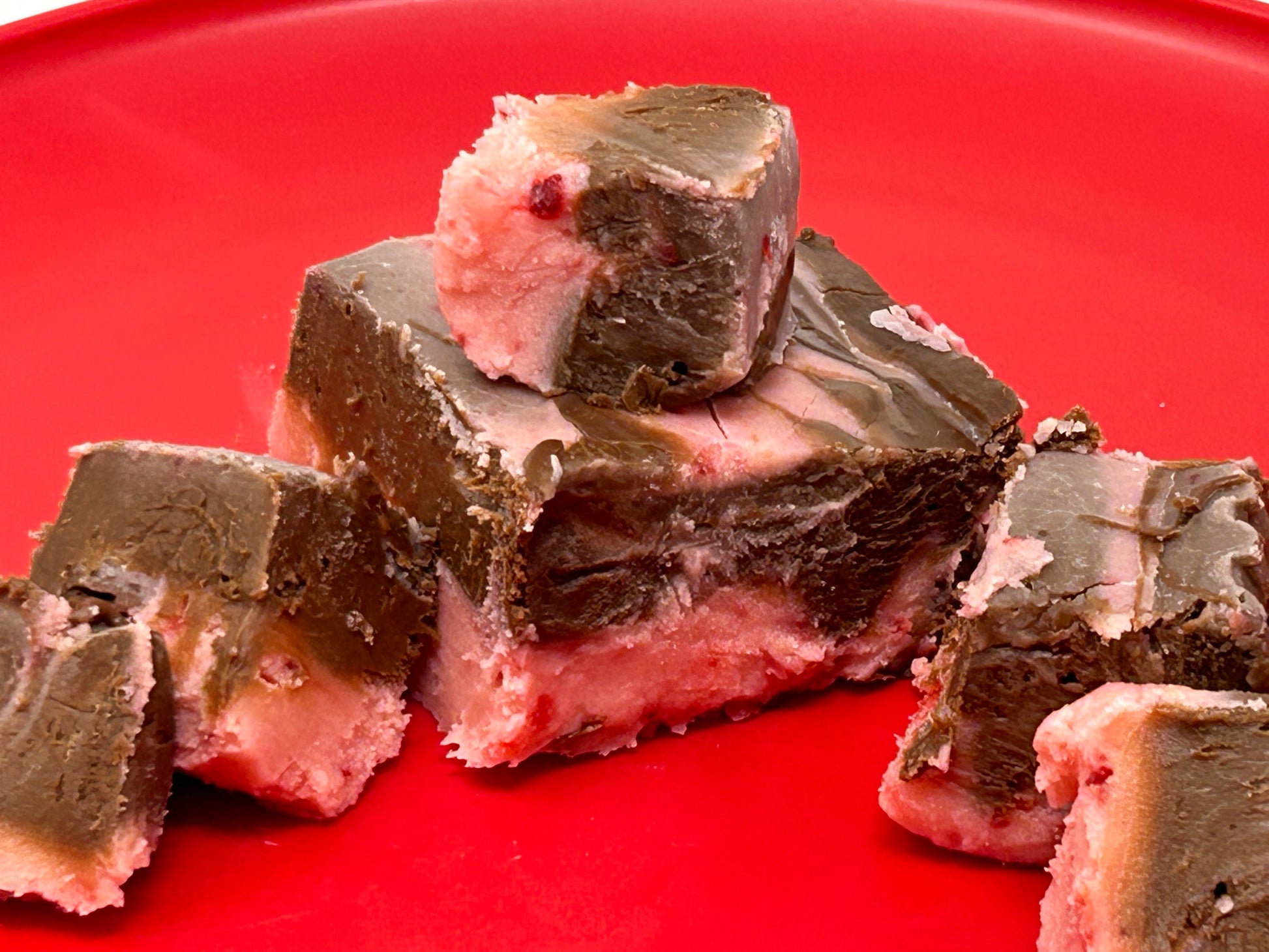 Chocolate strawberry fudge on a red plate