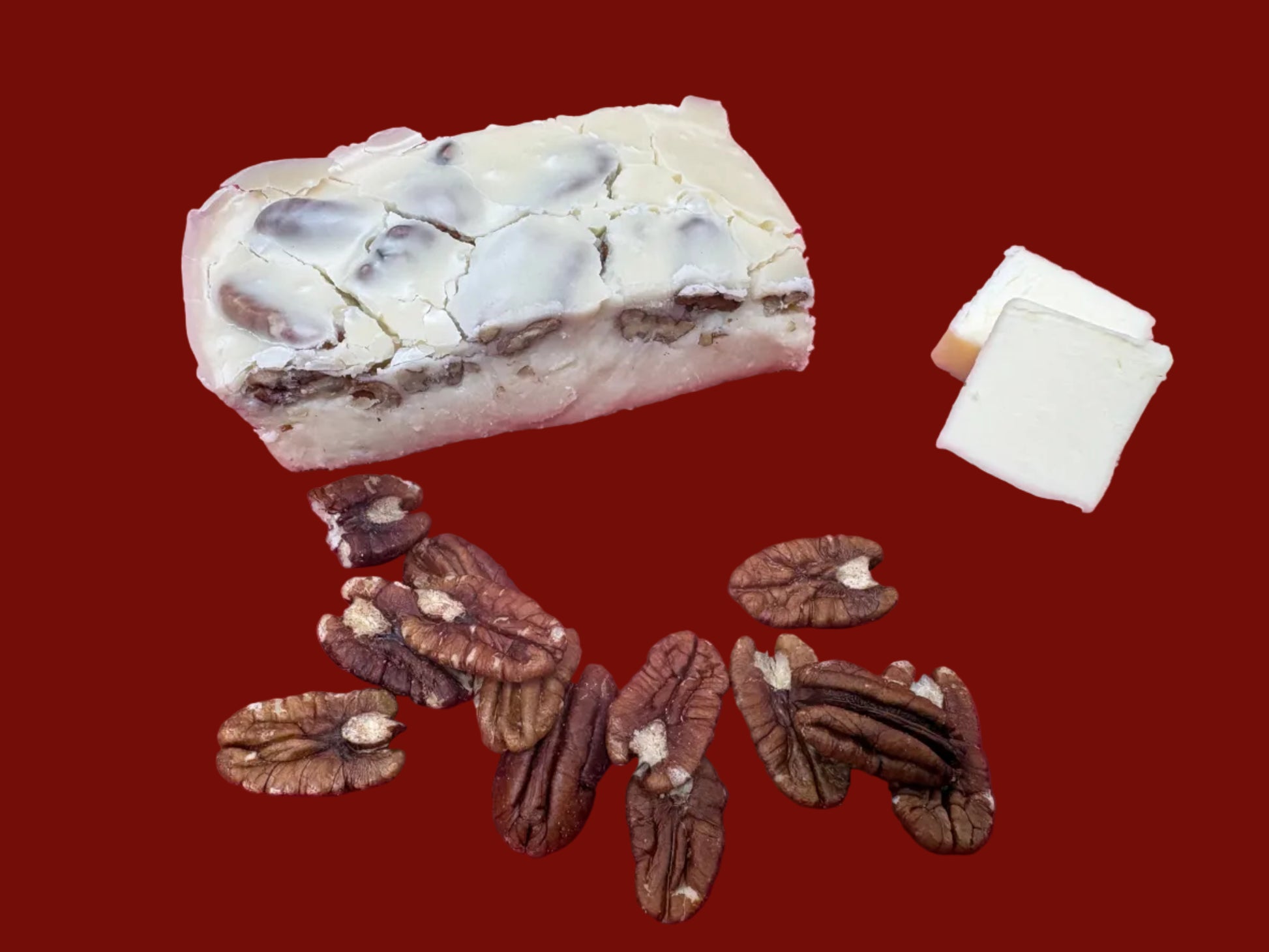 8 ounce piece of Butter Pecan Fudge surrounded by pecans and slices of butter.