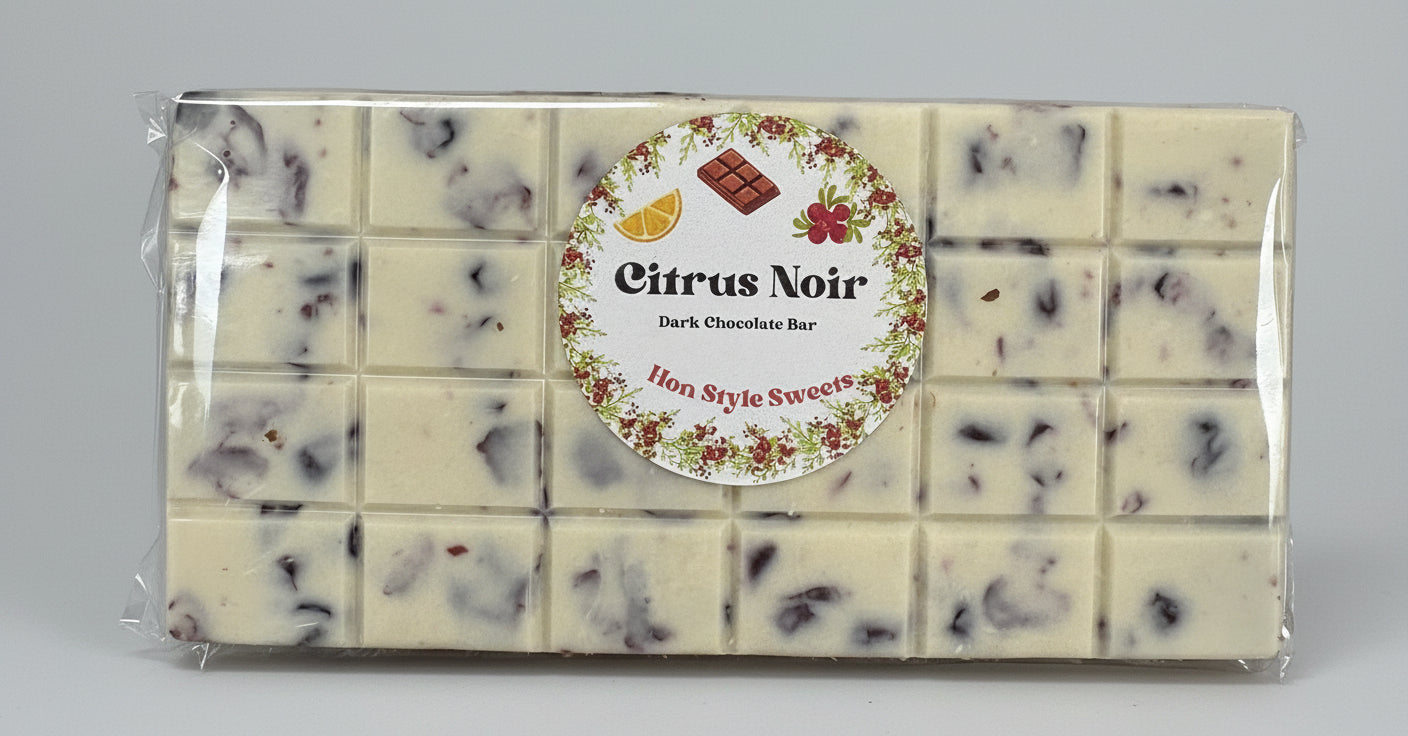 Packaged dark chocolate bar with Dried Cranberries, branded 'Citrus Noir'.